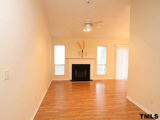 3605 Christine Court Raleigh, NC 27604 - Photo 2 of 12 a view of a livingroom with a fireplace and window
