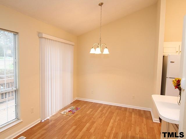 3605 Christine Court Raleigh, NC 27604 - Photo 4 of 12 a view of empty room with wooden floor and fan