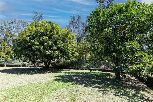 an aerial view of a house with outdoor space