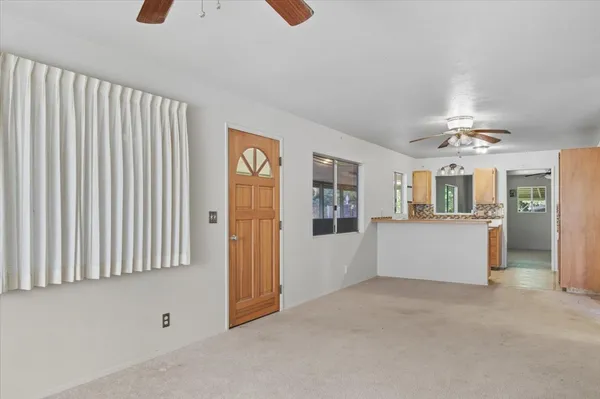 a view of an empty room with a window