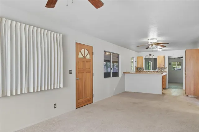 a view of an empty room with a window