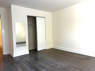 794 Broadway, Unit 3 Bayonne, NJ 07002 - Photo 2 of 12 an empty room with wooden floor and windows