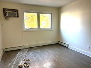 794 Broadway, Unit 3 Bayonne, NJ 07002 - Photo 4 of 12 an empty room with a window