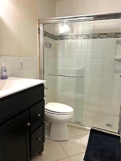 794 Broadway, Unit 3 Bayonne, NJ 07002 - Photo 6 of 12 a bathroom with a sink a toilet and a shower