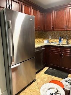 794 Broadway, Unit 3 Bayonne, NJ 07002 - Photo 7 of 12 a kitchen with stainless steel appliances granite countertop a refrigerator and a sink