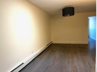 794 Broadway, Unit 3 Bayonne, NJ 07002 - Photo 9 of 12 a view of a room with wooden floor and a window