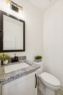 a living room with furniture fireplace and a flat screen tv