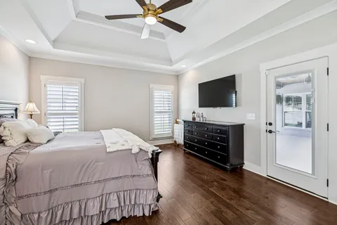 a bedroom with a bed and a flat screen television