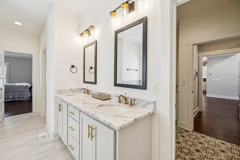 a view of a hallway with wooden floor and stairs
