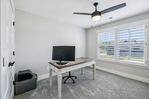a front view of a house with garage