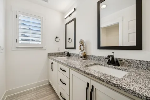 an aerial view of a house with garden space and street view