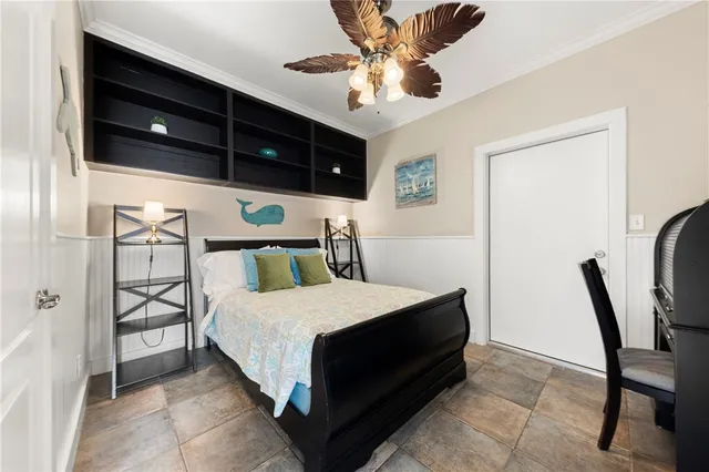 a bedroom with a bed a desk and chair