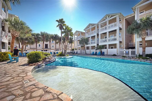 a view of a building with a yard