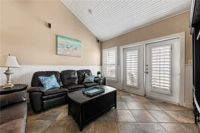 a living room with furniture and a window