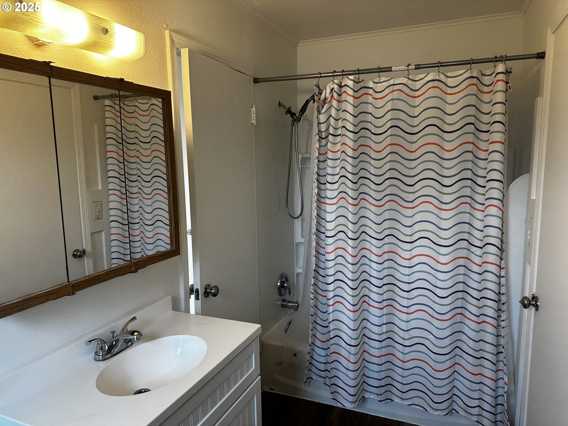 818 South 1st Street Cottage Grove, OR 97424 - Photo 19 of 22 a bathroom with a sink and a mirror