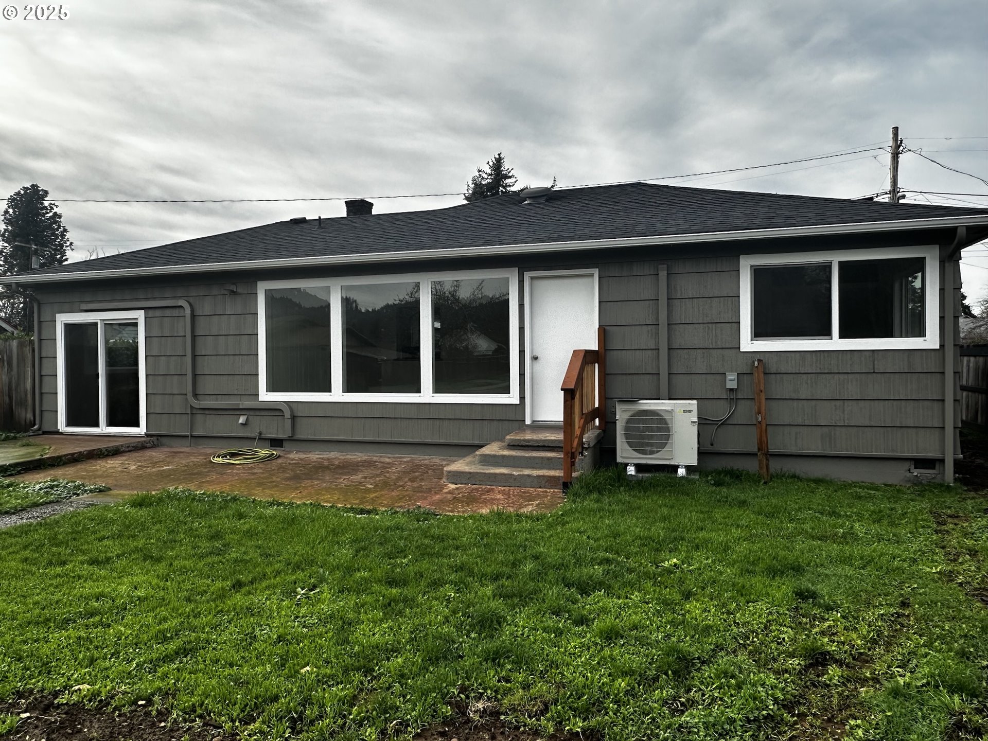 818 South 1st Street Cottage Grove, OR 97424 - Photo 5 of 22 a front view of a house with a garden and yard
