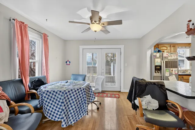 a bedroom with furniture and wooden floor