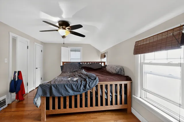 a bedroom with furniture and a window
