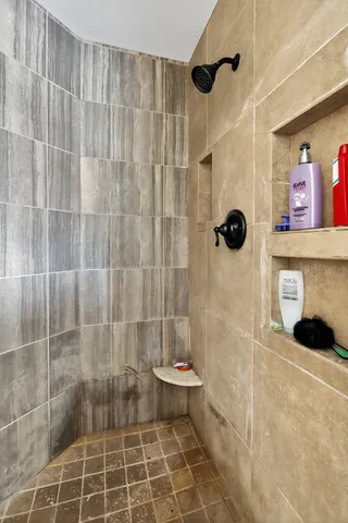 a bathroom with a sink mirror and vanity