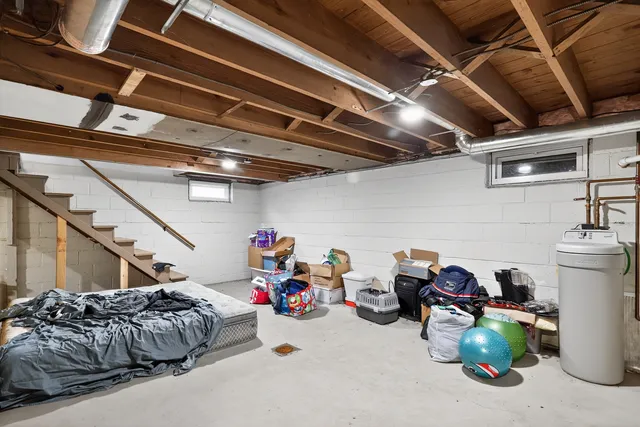 a view of entryway with wooden floor and a front door