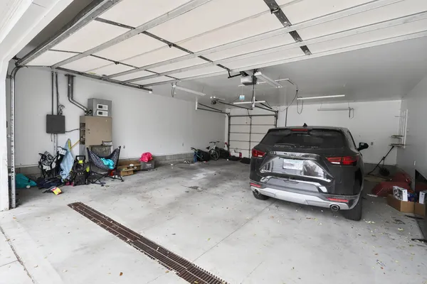 a view of a yard with a house and a tree