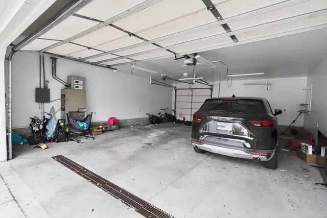 a view of a yard with a house and a tree