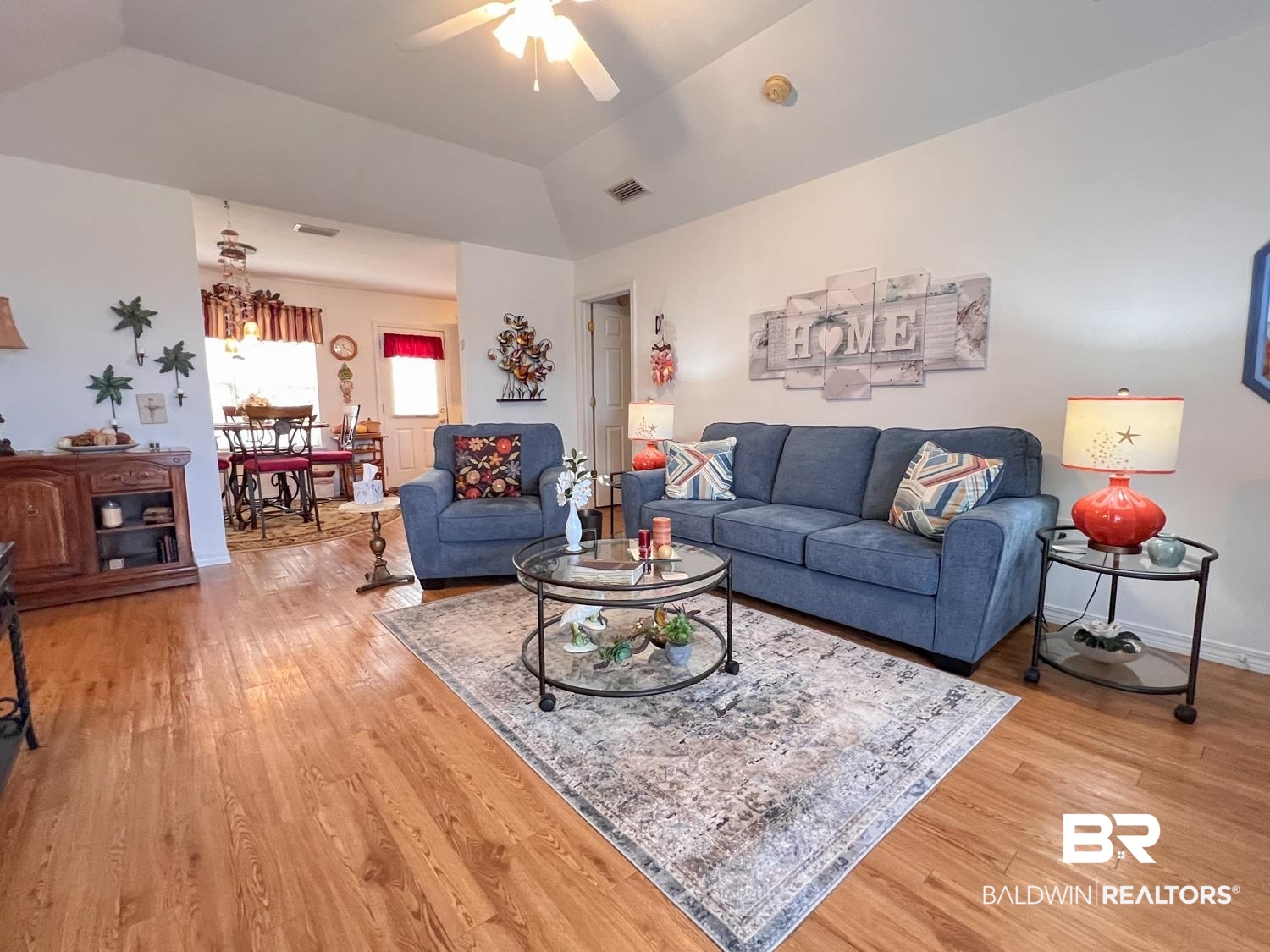 16690 Plum Court Loxley, AL 36551 - Photo 5 of 30 Living room featuring wood-type flooring, ceiling fan, and vaulted ceiling