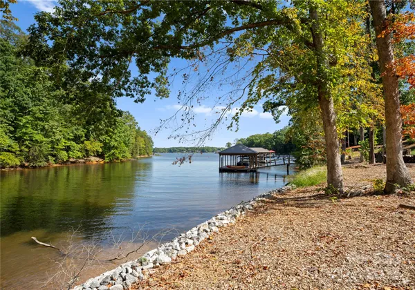 a view of a lake with a house in the background