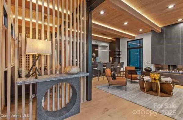 a view of living room with furniture and large window