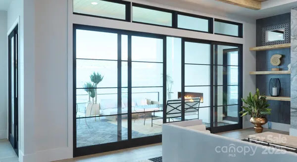 a living room with furniture a floor to ceiling window and potted plants