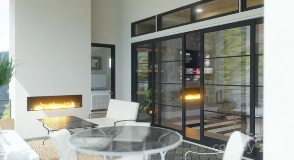 a living room with a large window and a flat screen tv