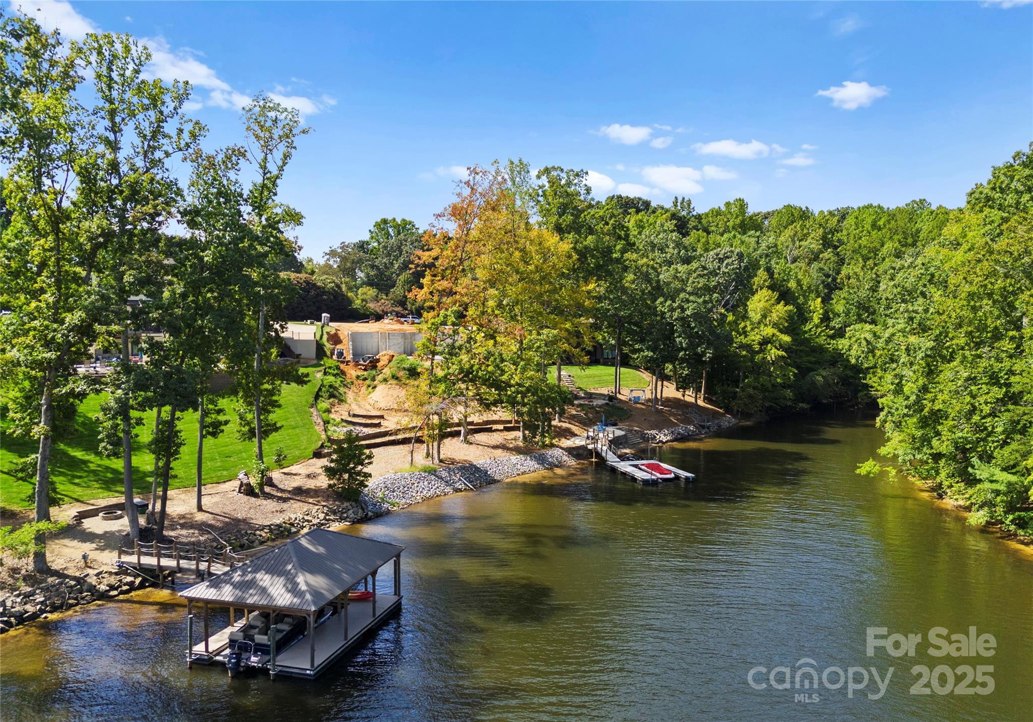 4218 Sigmon Cove Lane, Unit 6 Terrell, NC 28682 - Photo 8 of 39 a view of a lake with lawn chairs