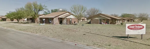 a view of a house with a street