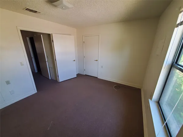 a view of empty room with front door