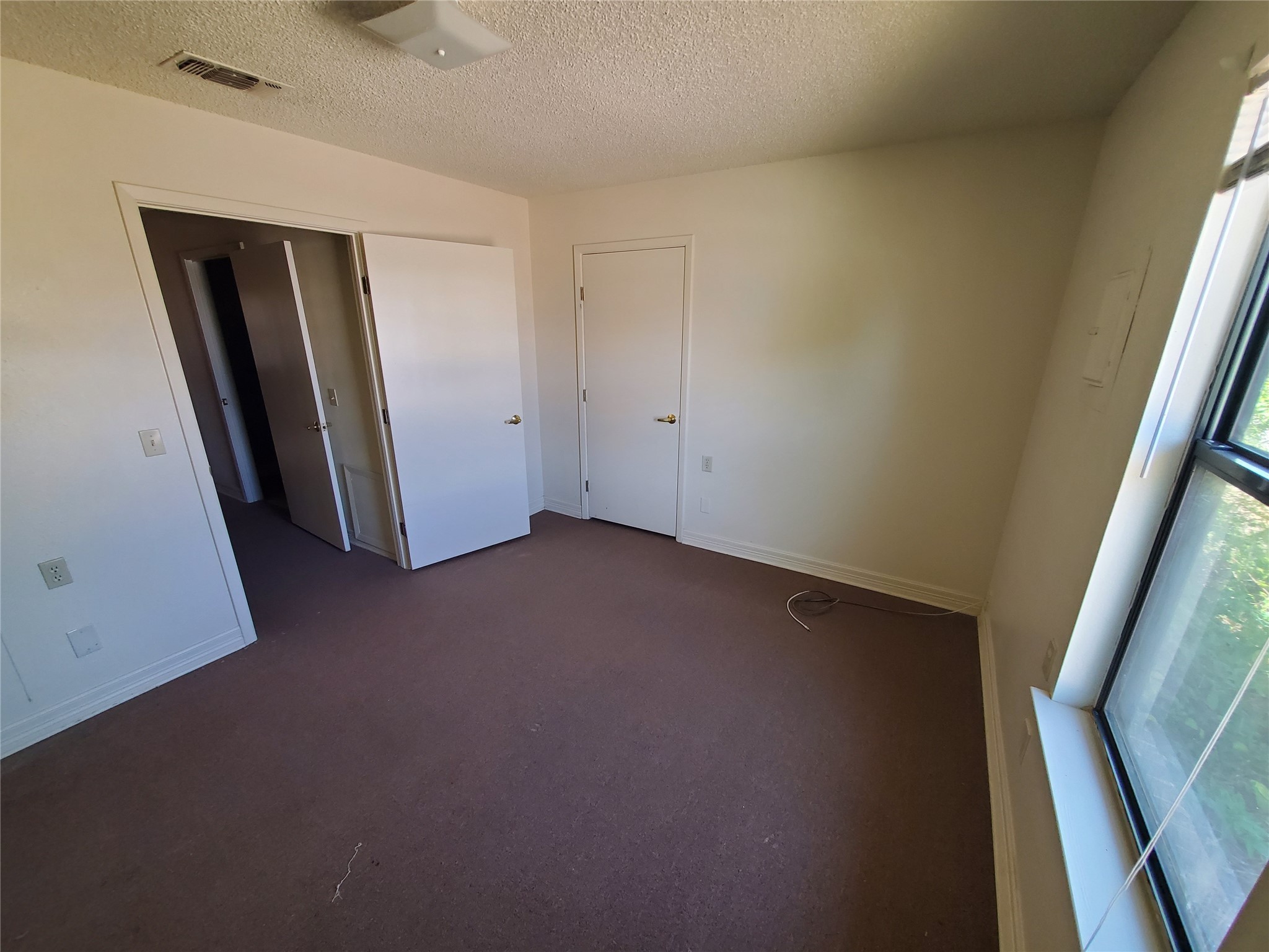 400 Northwest 2nd Street Seminole, TX 79360 - Photo 6 of 7 a view of empty room with front door