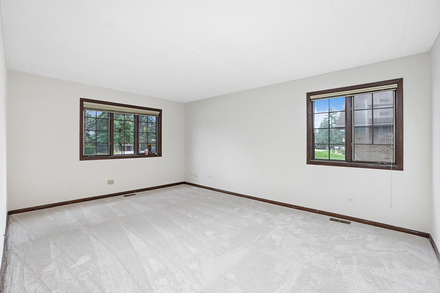 13222 South Oak Ridge Trail, Unit 1A Palos Heights, IL 60463 - Photo 15 of 21 an empty room with windows