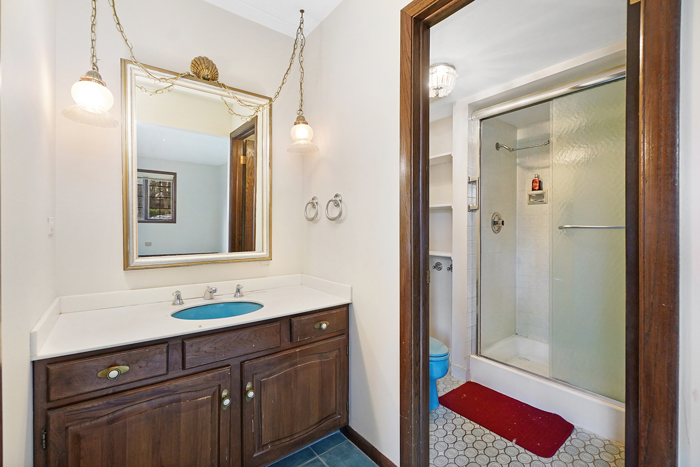 13222 South Oak Ridge Trail, Unit 1A Palos Heights, IL 60463 - Photo 16 of 21 a bathroom with a sink a vanity and a mirror