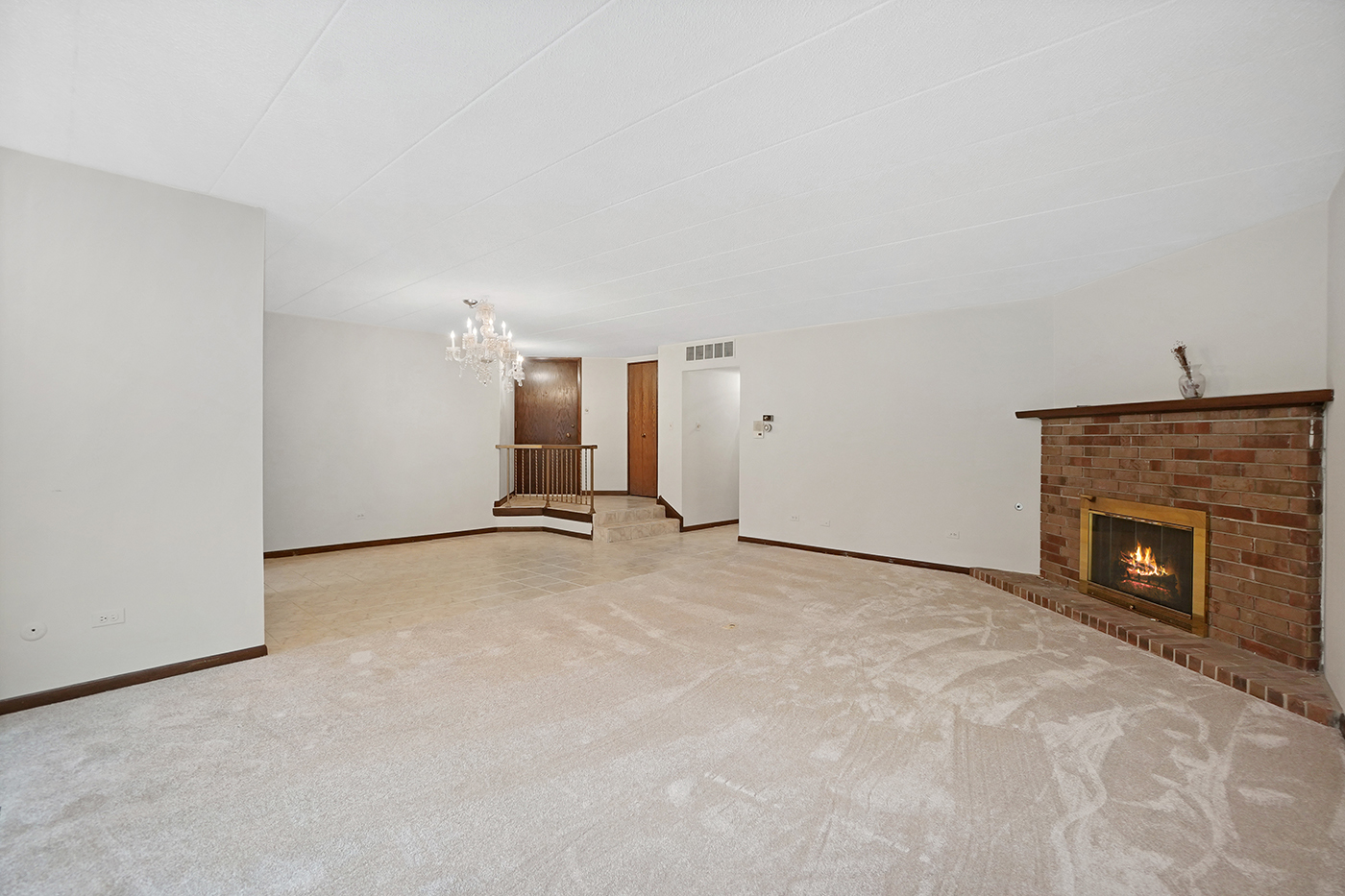13222 South Oak Ridge Trail, Unit 1A Palos Heights, IL 60463 - Photo 5 of 21 a view of empty room with a fireplace