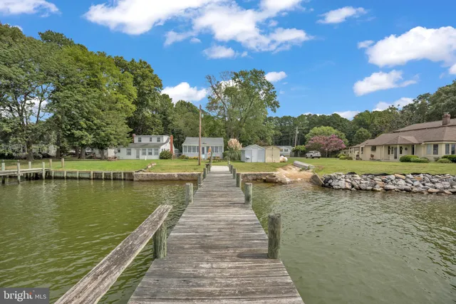 a view of a lake with a house in the background