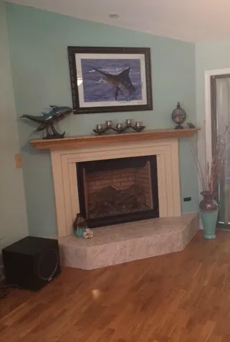 a living room with a fireplace and a stove