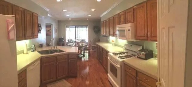 a kitchen with sink cabinets and outdoor space