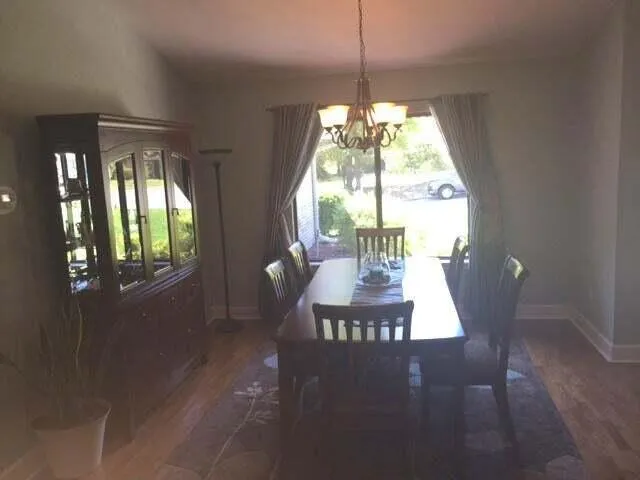 a view of a hallway with a livingroom and couch
