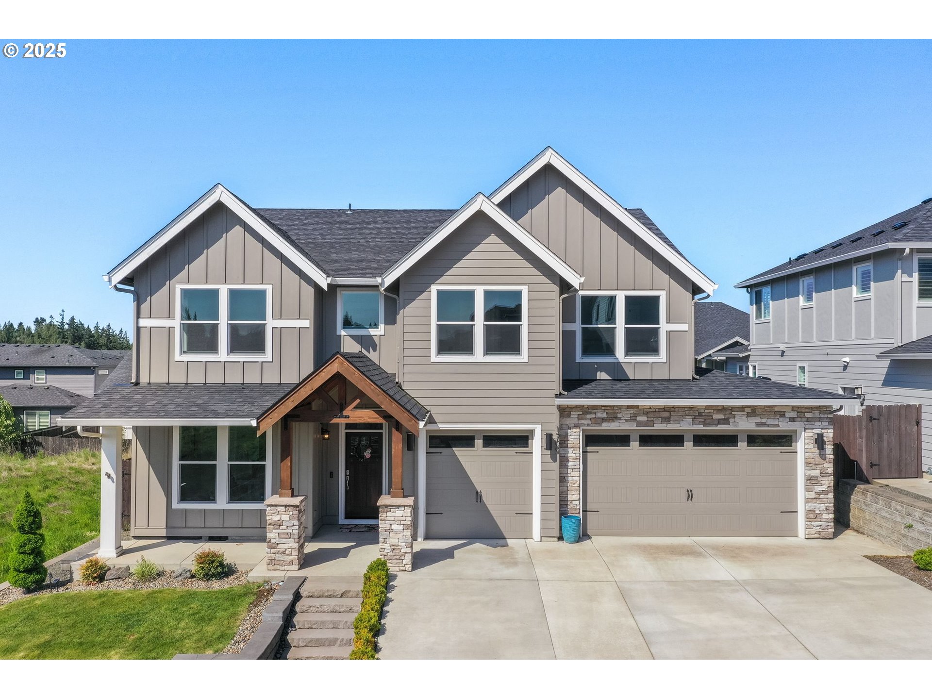1709 South 43rd Place Ridgefield, WA 98642 - Photo 1 of 24 a front view of a house with a yard and garage