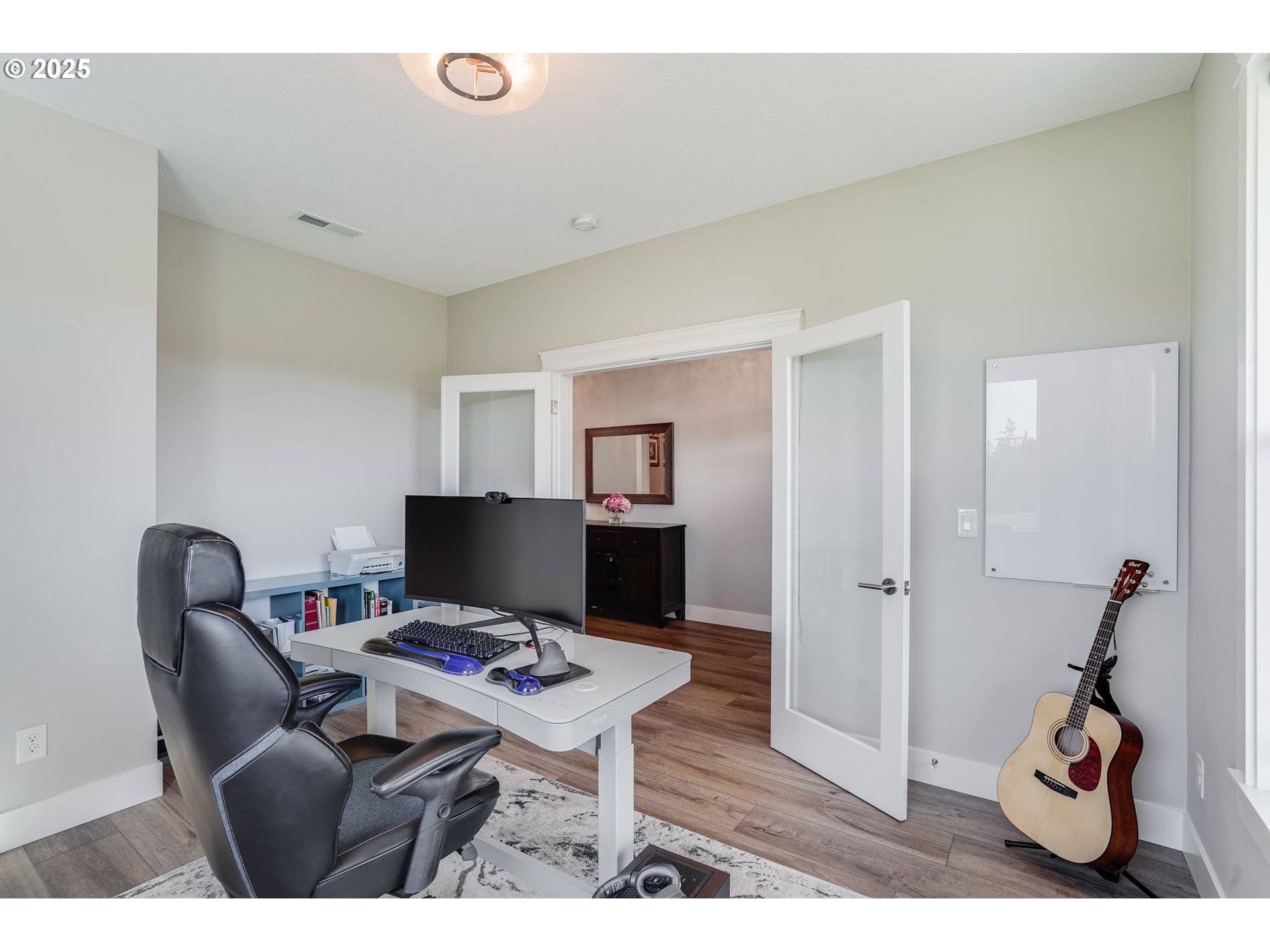 1709 South 43rd Place Ridgefield, WA 98642 - Photo 13 of 24 a workspace with furniture and wooden floor