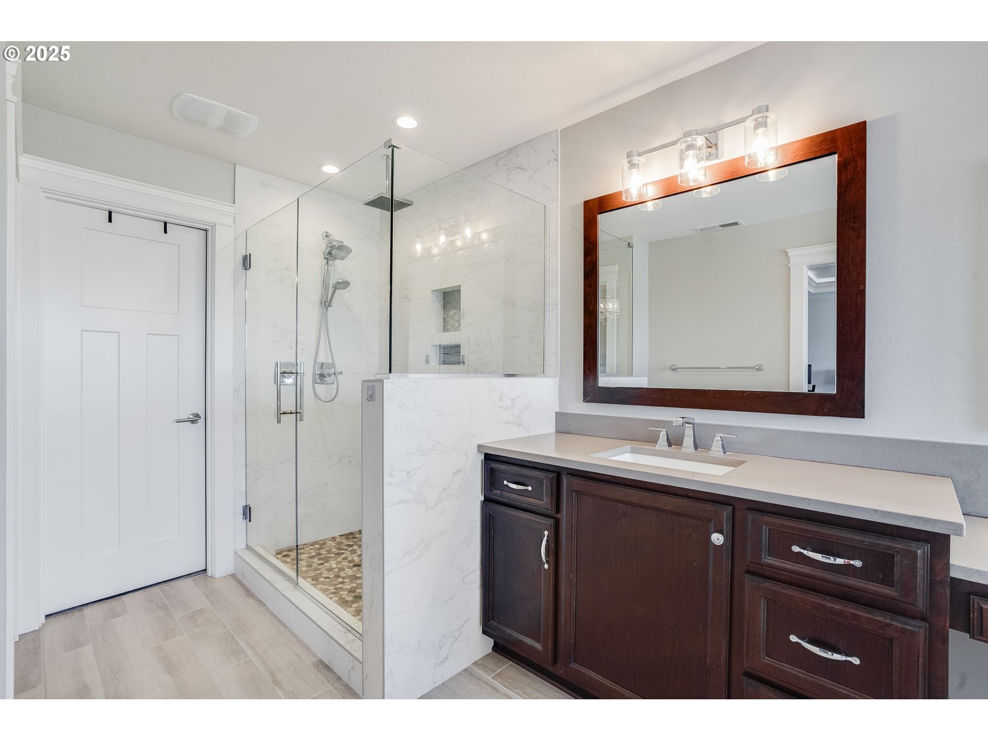 1709 South 43rd Place Ridgefield, WA 98642 - Photo 16 of 24 a bathroom with a sink vanity and a mirror