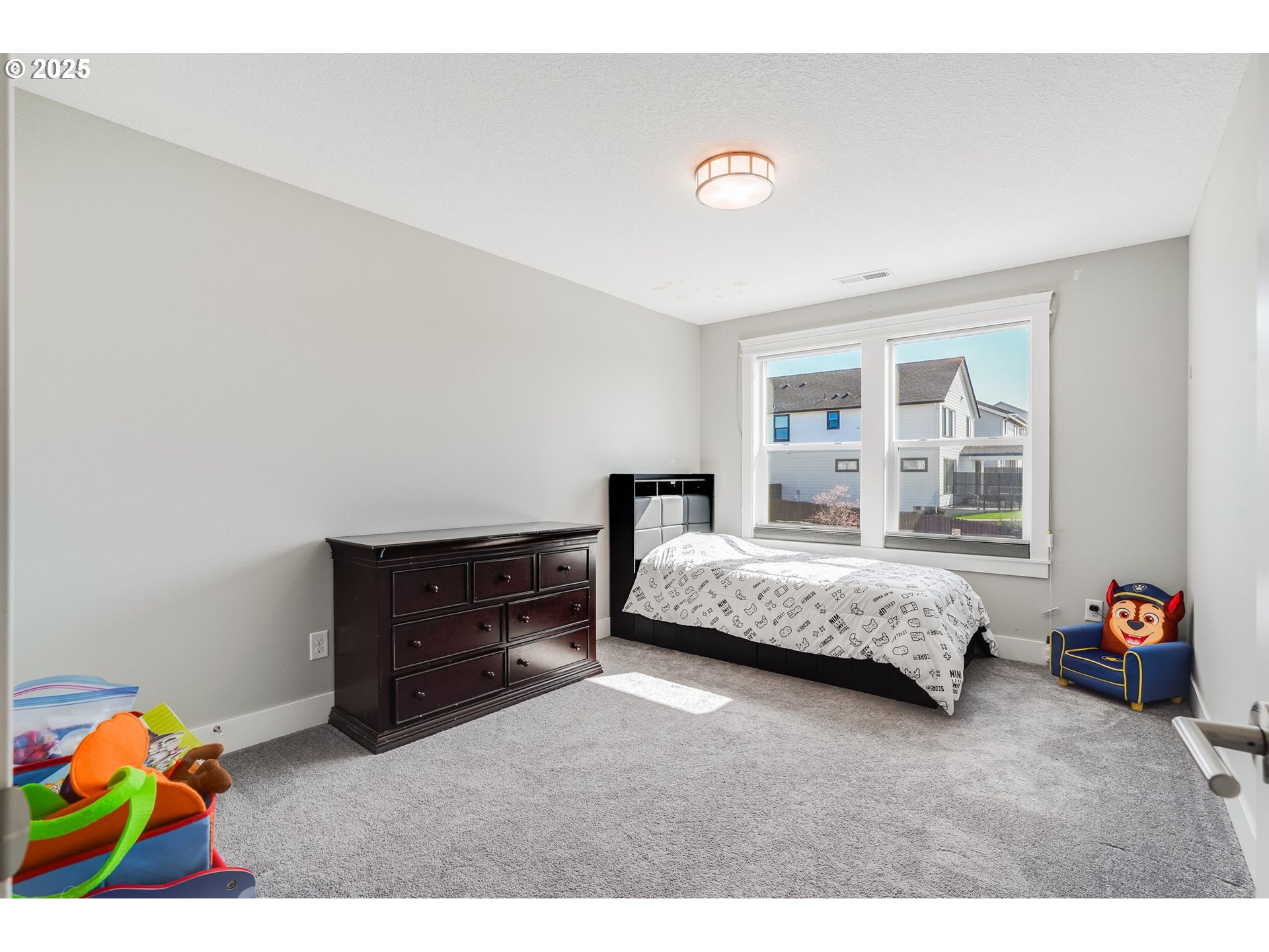 1709 South 43rd Place Ridgefield, WA 98642 - Photo 17 of 24 a bedroom with a bed and a window