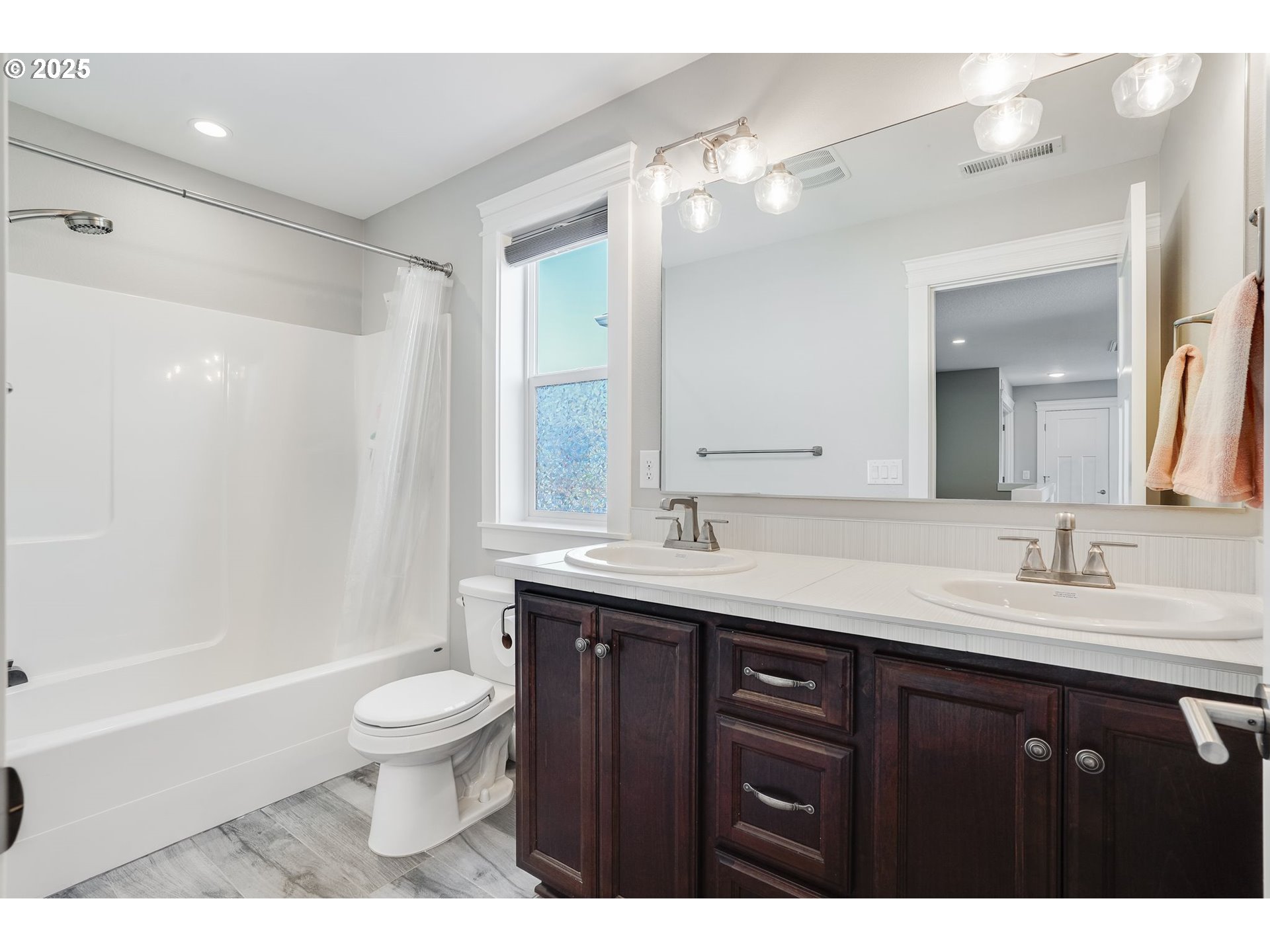 1709 South 43rd Place Ridgefield, WA 98642 - Photo 18 of 24 a bathroom with a sink and a mirror