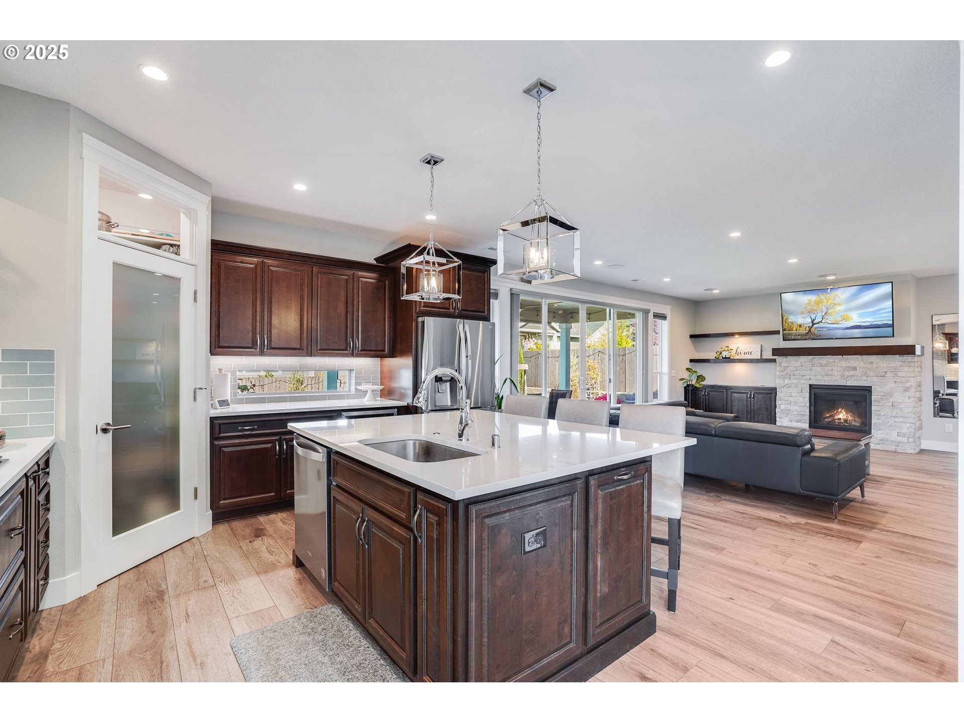 1709 South 43rd Place Ridgefield, WA 98642 - Photo 5 of 24 a kitchen with stainless steel appliances granite countertop a sink a stove and a refrigerator