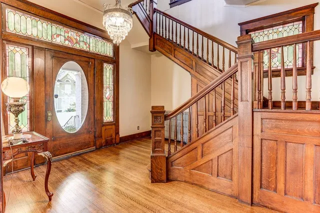 a view of an entryway with wooden floor