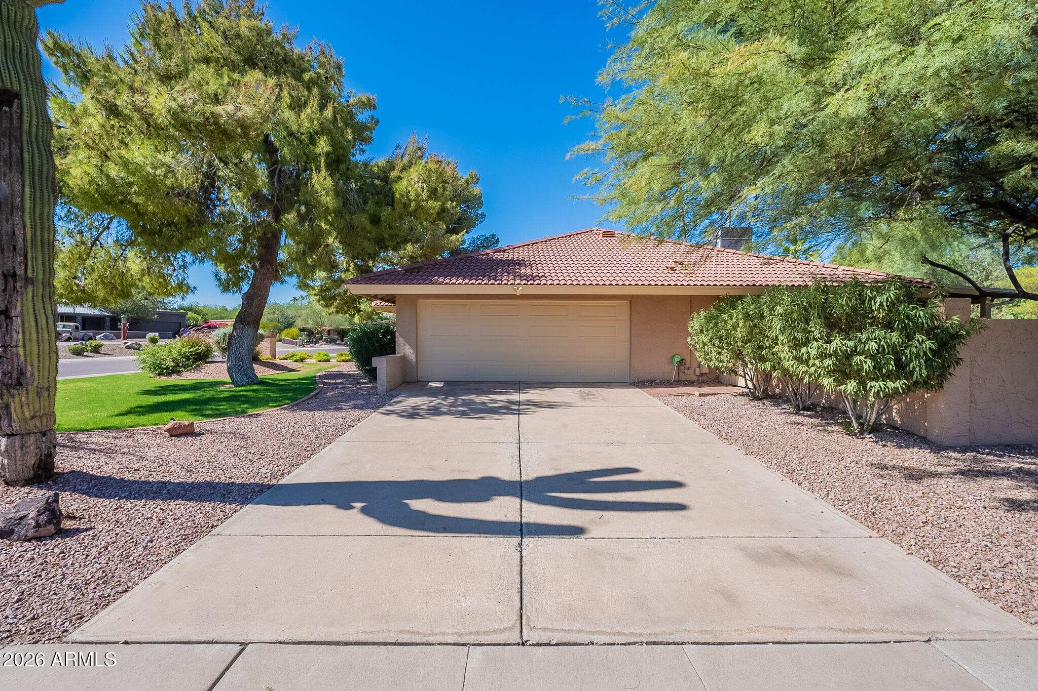 4226 East North Lane Phoenix, AZ 85028 - Photo 43 of 43 a view of a white house with a yard and plants
